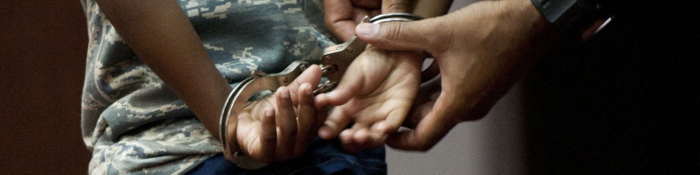 A child being handcuffed
